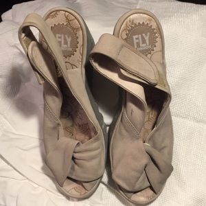 Leather butter soft sling back wedge. tan colored